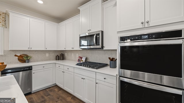 kitchen featuring light countertops, white cabinetry, and appliances with stainless steel finishes