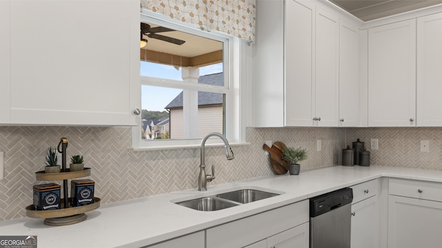 kitchen with backsplash, a sink, and dishwasher
