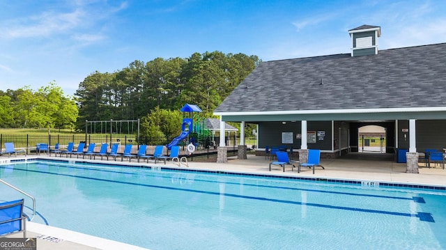 community pool featuring fence and a patio area