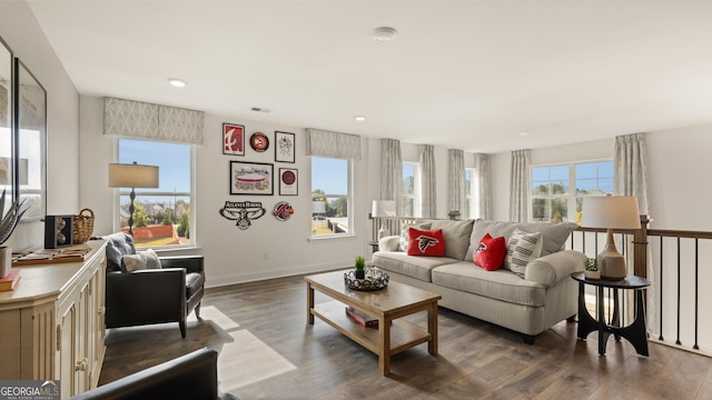 living area featuring recessed lighting, baseboards, visible vents, and wood finished floors