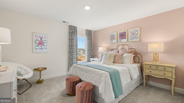 bedroom with baseboards, carpet flooring, and visible vents