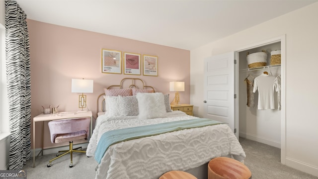 carpeted bedroom with baseboards and a closet