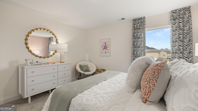 bedroom featuring baseboards, carpet, and visible vents