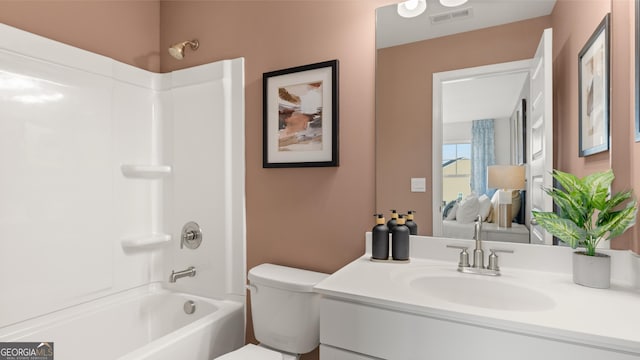 bathroom with toilet, visible vents, bathing tub / shower combination, and vanity