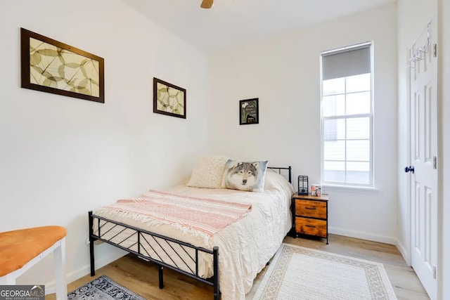 1418 2nd Ave, Macon, GA 31201 - bedroom with baseboards, a ceiling fan, and wood finished floors