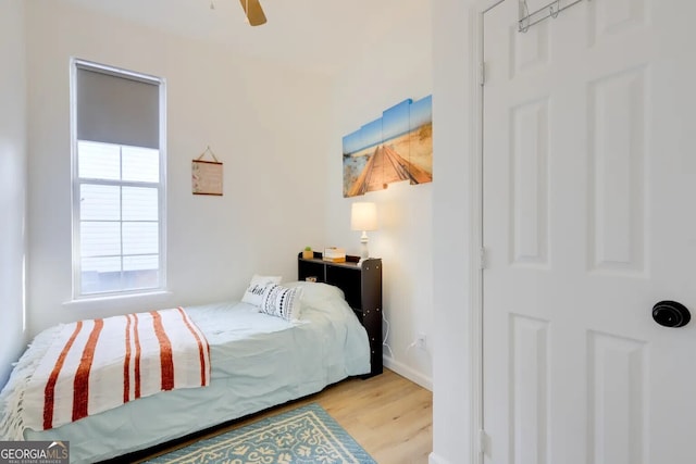 1418 2nd Ave, Macon, GA 31201 - bedroom with baseboards, light wood-type flooring, and a ceiling fan