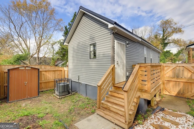 1418 2nd Ave, Macon, GA 31201 - view of outbuilding featuring central AC, a fenced backyard, and a gate