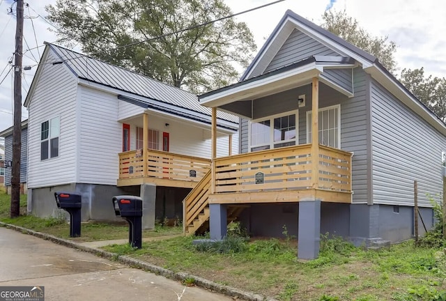 1418 2nd Ave, Macon, GA 31201 - back of property with metal roof, stairs, and a deck