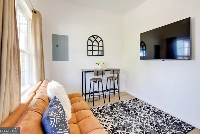 1418 2nd Ave, Macon, GA 31201 - living area featuring baseboards, electric panel, and wood finished floors