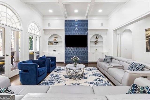 living room with beam ceiling, dark wood finished floors, and french doors