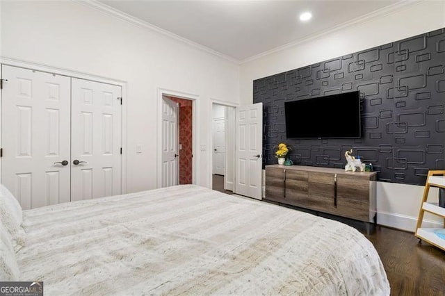 bedroom with crown molding, baseboards, and dark wood-style floors