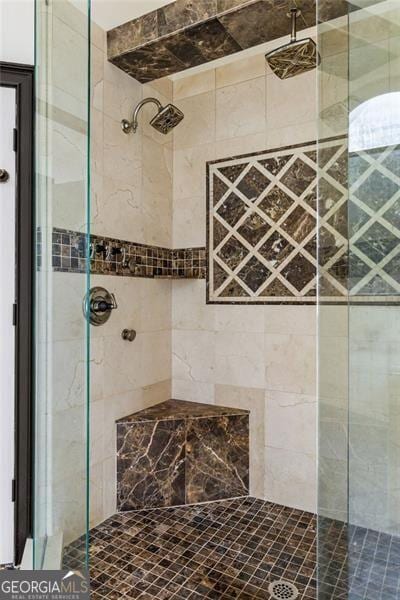 bathroom featuring a shower stall