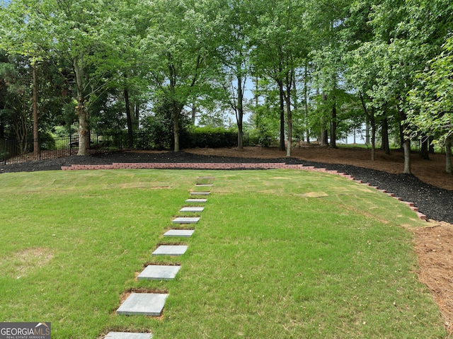 view of yard featuring fence