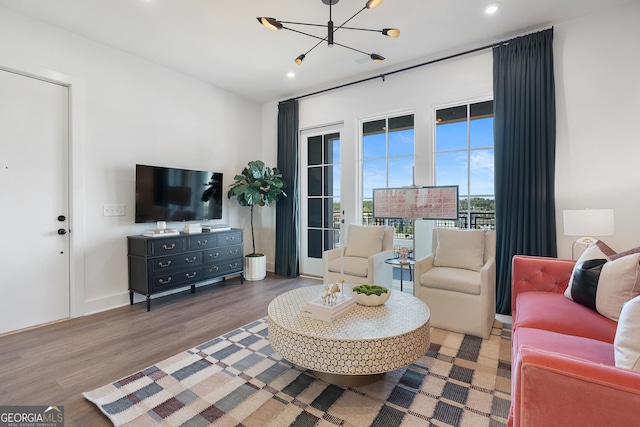 128 Bert Ln SE Unit 167, Atlanta, GA 30316 - living area featuring recessed lighting, wood finished floors, and a chandelier