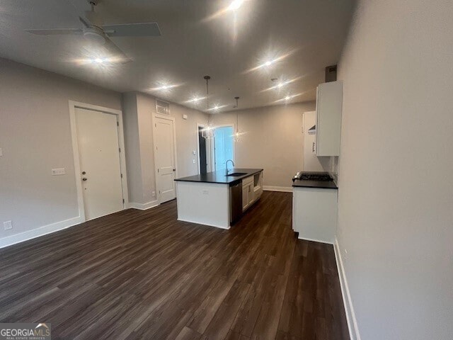 128 Bert Ln SE Unit 167, Atlanta, GA 30316 - kitchen featuring white cabinets, dark countertops, a sink, baseboards, and dark wood-type flooring