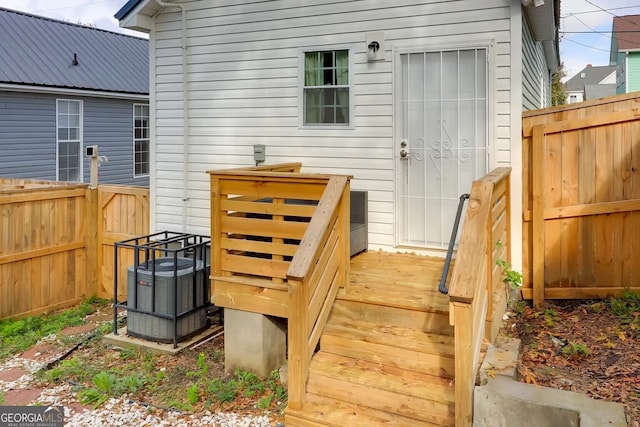 wooden terrace featuring a fenced backyard
