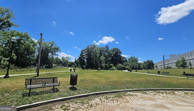 surrounding community with a yard