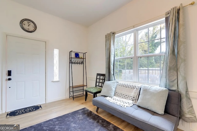 living area with wood finished floors and baseboards