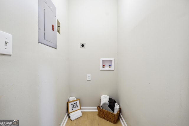 clothes washing area featuring washer hookup, laundry area, baseboards, electric dryer hookup, and electric panel