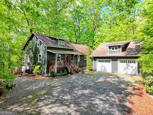 234 Raindance Ln, Clayton, GA 30525 - view of front of home with a porch, a garage, fence, stairs, and board and batten siding