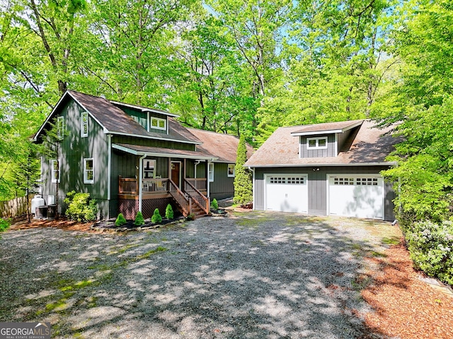 234 Raindance Ln, Clayton, GA 30525 - craftsman house featuring covered porch, a detached garage, and stairway