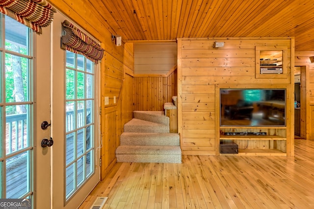 234 Raindance Ln, Clayton, GA 30525 - staircase with wood walls, hardwood / wood-style flooring, and wood ceiling