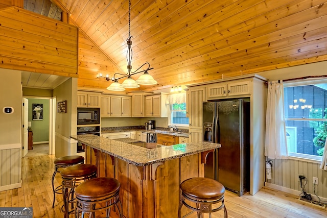 234 Raindance Ln, Clayton, GA 30525 - kitchen featuring black appliances, light wood-style flooring, wood ceiling, a kitchen breakfast bar, and plenty of natural light