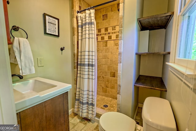 234 Raindance Ln, Clayton, GA 30525 - bathroom with toilet, a stall shower, baseboards, vanity, and stone finish floors