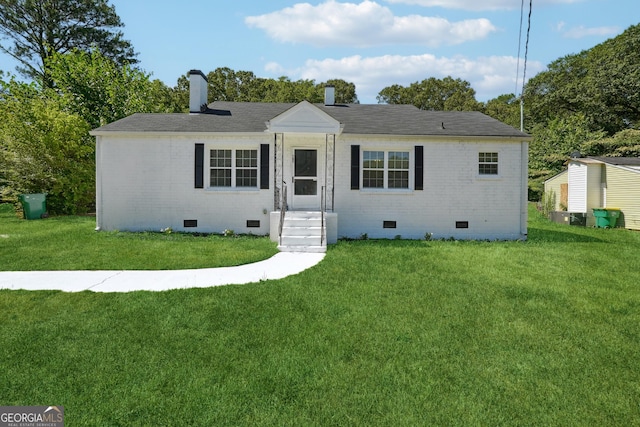 785 Alice St, Forest Park, GA 30297 - view of front of house featuring a chimney, brick siding, a front lawn, and crawl space