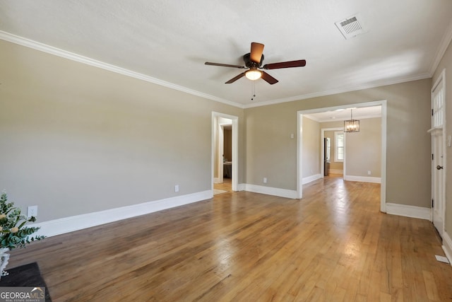 785 Alice St, Forest Park, GA 30297 - spare room with baseboards, visible vents, ceiling fan with notable chandelier, and light wood-style floors