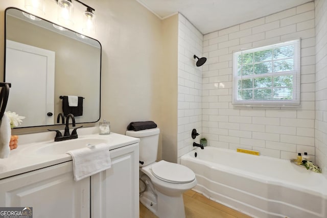 785 Alice St, Forest Park, GA 30297 - full bathroom featuring toilet, shower / washtub combination, wood finished floors, and vanity