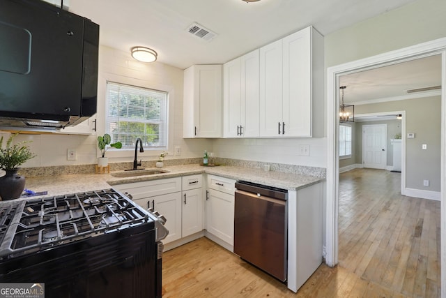 785 Alice St, Forest Park, GA 30297 - kitchen with visible vents, gas range, stainless steel dishwasher, a sink, and light wood finished floors