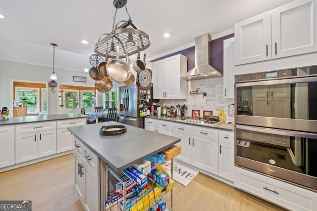 kitchen featuring backsplash, stainless steel appliances, dark countertops, and wall chimney exhaust hood