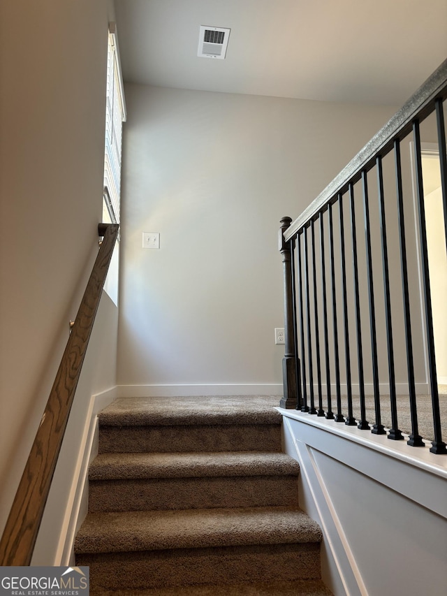 staircase with visible vents