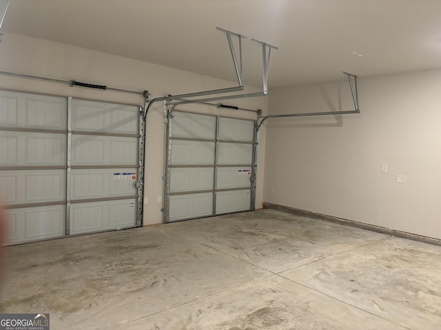 garage featuring baseboards
