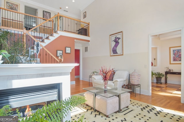 living room with visible vents, crown molding, stairway, baseboards, and recessed lighting