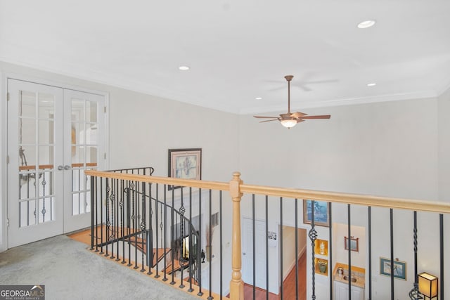 hall with french doors, recessed lighting, crown molding, and an upstairs landing