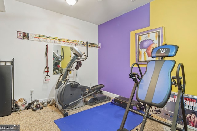 exercise room with baseboards