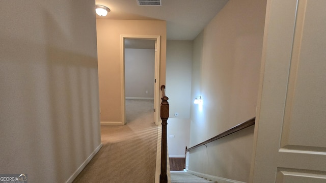 stairs with baseboards, carpet flooring, and visible vents