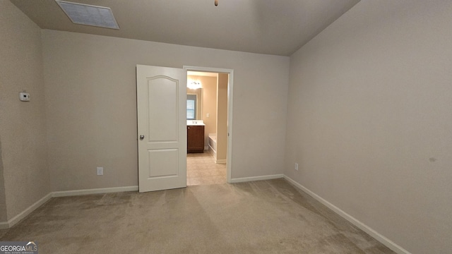 unfurnished room with visible vents, baseboards, and light carpet