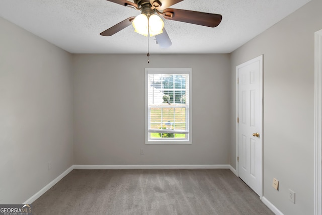 90 Heatherstone Way, Covington, GA 30016 - empty room featuring baseboards, carpet, a ceiling fan, and a textured ceiling