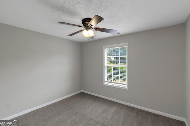 90 Heatherstone Way, Covington, GA 30016 - spare room with a ceiling fan, a textured ceiling, visible vents, baseboards, and carpet flooring