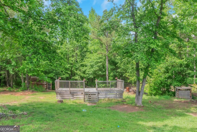 90 Heatherstone Way, Covington, GA 30016 - view of property's community featuring a wooden deck and a yard