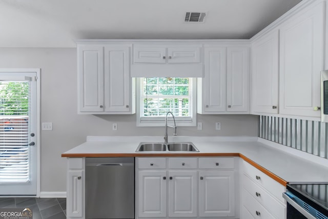 90 Heatherstone Way, Covington, GA 30016 - kitchen featuring a sink, dishwasher, light countertops, white cabinetry, and visible vents