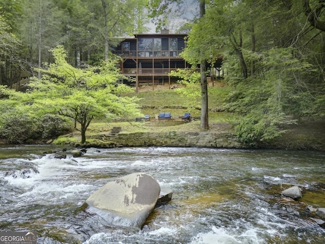 view of water feature with a view of trees