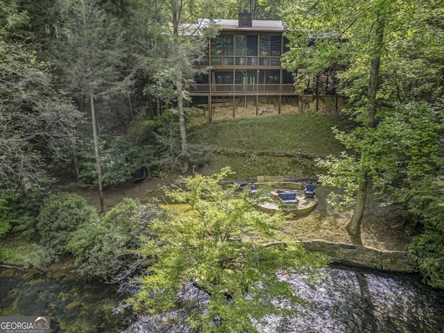 drone / aerial view with a view of trees