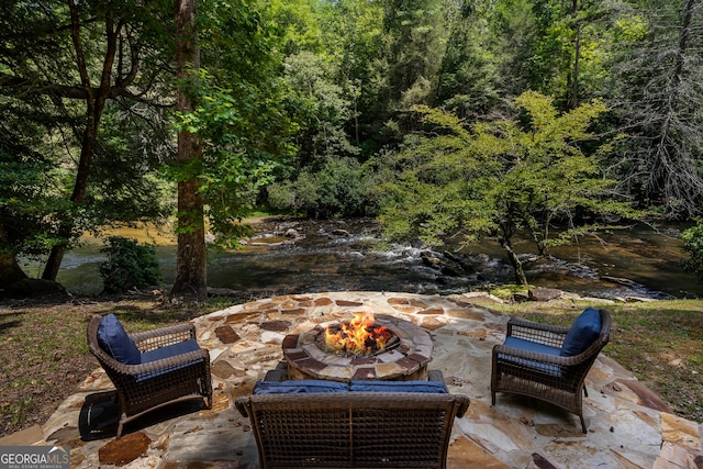 360 Cascade Pt, Ellijay, GA 30540 - view of patio / terrace with a fire pit and a view of trees
