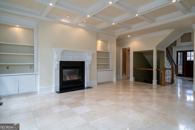 unfurnished living room featuring built in features, stairs, a fireplace with flush hearth, beamed ceiling, and coffered ceiling