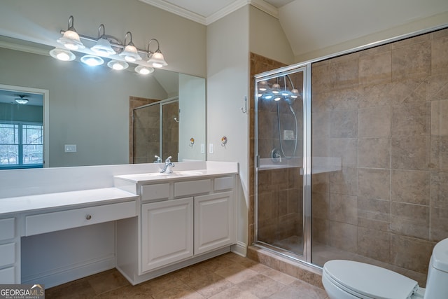 bathroom featuring toilet, crown molding, and a shower stall