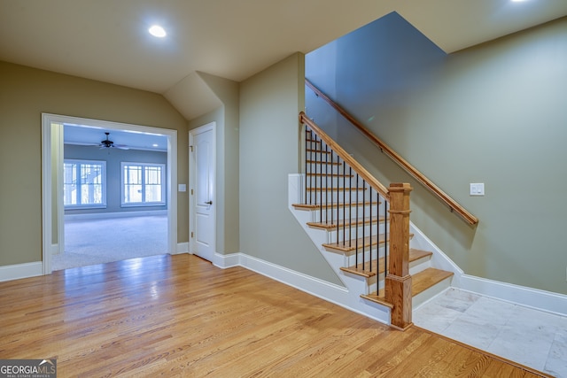 staircase with recessed lighting, baseboards, and wood finished floors